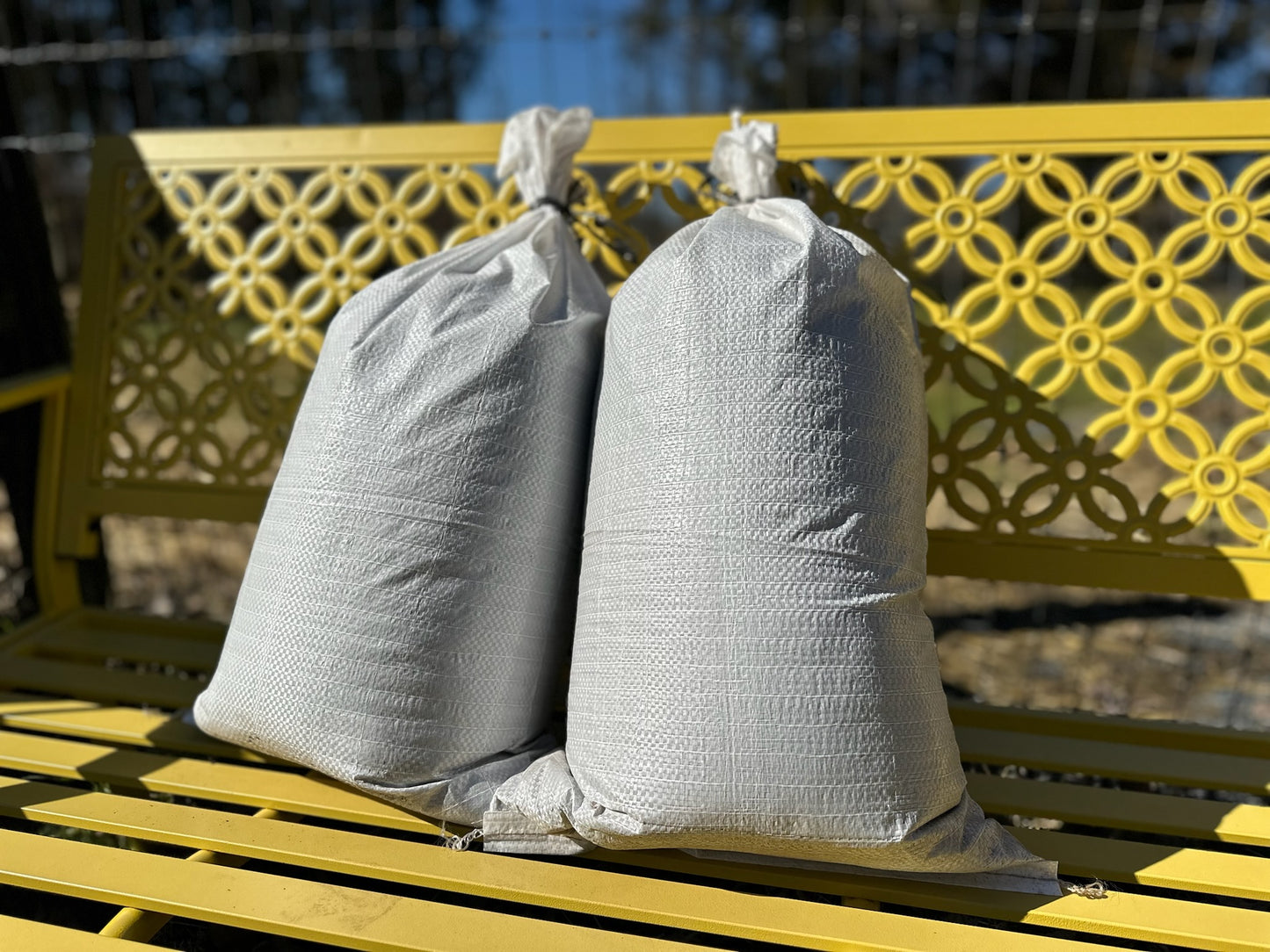 Bags of worm castings on a bench